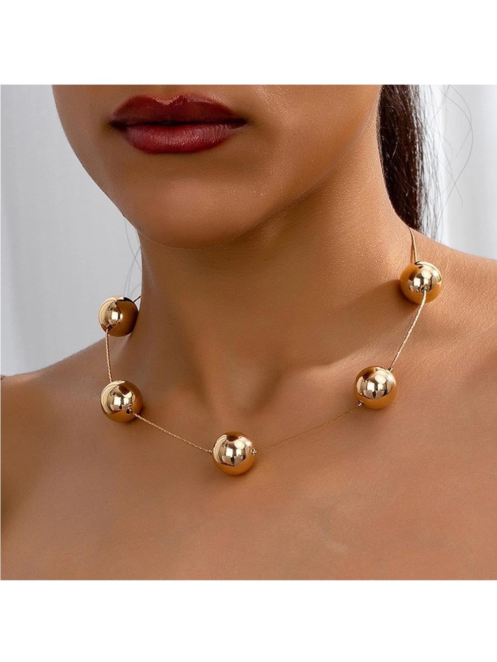 Thick plastic necklace with large gold beads for women, adjustable .
